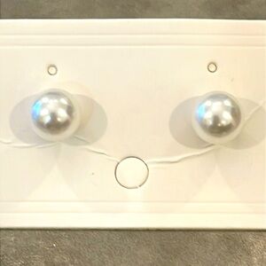 A pair of classic 8 mm faux pearls stud earrings